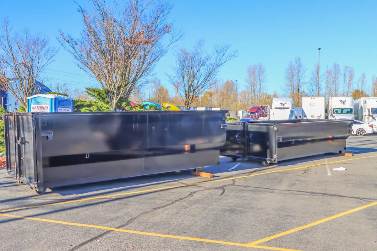 Professional dumpster rental service with roll-off container on residential driveway in Stevenson Ranch